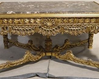 Marble top heavily carved table