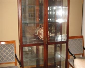 lighted display cabinet with bi-fold door