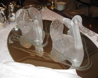 Pair of Lalique crystal swans on oval mirror with etched wakes