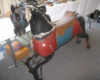 Antique carousel horse.  paint has been stripped on one side. Believed to be a jumper. We are taking bids on this.