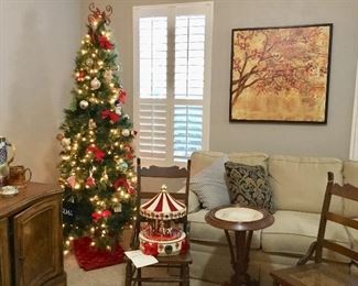 Christmas, art, sectional couch, plant/ wine s and, antique chairs 