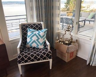 another chandelier and one of the pair of Oly armchairs for sale in a lattice patterned fabric asking $890 for the pair Retail price is roughly $2500 each new