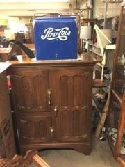 One more cabinet with a Pepsi-Cola bin on top.