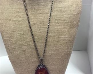 2.  Amber pendant on sterling chain 3 1/2” with bail, 11” long chain. 22” total