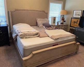 LIKE NEW wood-framed, upholstered king bed.