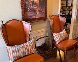 Pair of these burnt orange nailhead trimmed chairs.  Really unique.