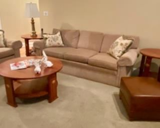 Fabulous like-new Stickley Furniture - including the two Sofas (they look drab in this pic, but they are really great looking and extremely comfortable and mint condition, also there are two leather Stickley club chairs that swivel - one shown here with an ottoman, and another. Also the side tables and the coffee table, as well as a sofa table behind the loveseat, also an entertainment credenza and the curio cabinet. Wowsa that's a lot of better than new Stickley furniture - some of the best you can buy!