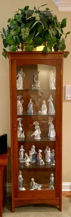 Again,  a Stickley Curio Cabinet, Lit, and chock full of Collector Club Lladro figurines, many I've not seen.  We also have the original boxes, so they make nice gifts for the collector!