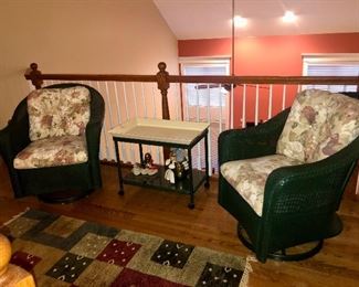 Swivel Rockers, in green wicker.  Also tray table on casters and area rug
