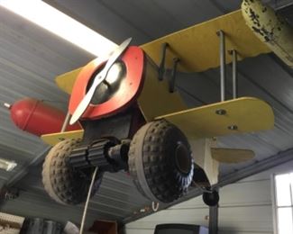 Child riding airplane made in 50’s