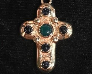 Gold cross with beryl center and sapphire cabachons.