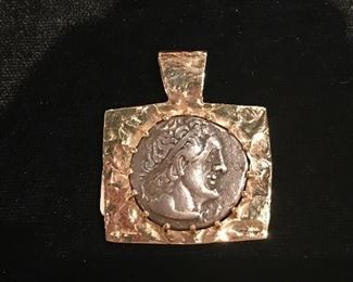 14 kt bezel on silver coin