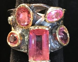 Sterling with gold bezel pink stone ring, 1 pink sapphire among the stones.  695. now 347.50