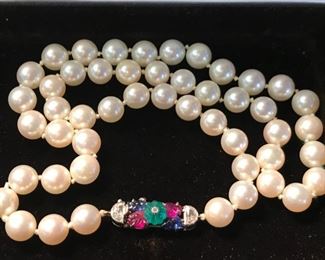 Art deco akoya pearl necklace circa 1930's  with clasp of carved emerald, sapphire, ruby and diamond  - French marks.Platinum clasp.