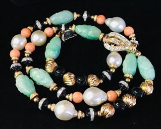 Jade,coral,gold,onyx and diamond,pearl and a diamond clasp necklace.  Now 1800.