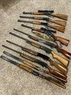 collection of over a dozen long guns and rifle...Winchester and Remington