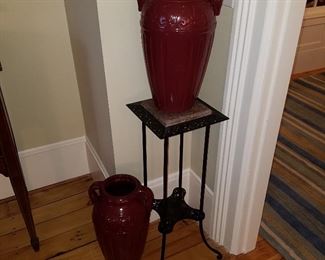 Cast iron plant stand with marble top.  Pair of matching urns by Robinson Ransbottom Pottery in Roseville, Ohio.   NOTE:  Discovered one pot has small chip underneath one handle