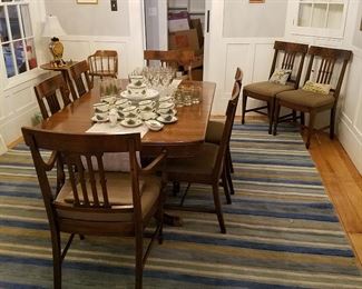 Kreiss dining set with extension table (comes with two leaves that do not match...tablecloth needed), and 8 matching chairs (2 with arms).   Striped rug for sale, too!