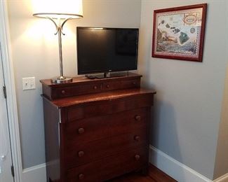 Mahogany finish dresser, Flat screen TV, One of a pair of lamps