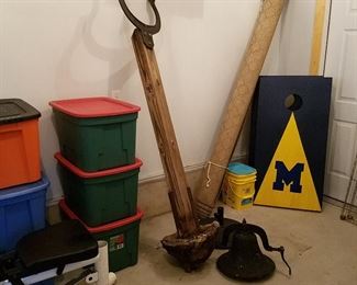 Storage totes, Cast iron bell with pole and yoke, U of M cornhole game