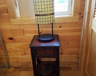 Stand displaying leaded glass contemporary lamp