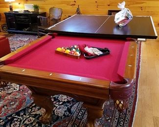 Billiards table, complete with balls, wall rack, and cues.  Comes with optional folding ping-pong top and supplies