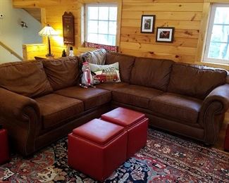 Suede fabric sectional sofa by Broyhill.  The red ottomans have lift off tray tops.