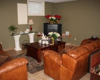 Leather sofas, coffee table, rug, decor