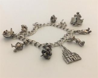Vintage Sterling Disney Charm Bracelet and Ring https://ctbids.com/#!/description/share/291670
