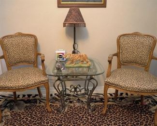 Pair of leopard print chairs and rug