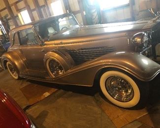 2 Door replica from Thailand with extraordinary wood interior. Starting Bid $10,000