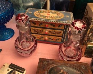 Pair of paperweight glass bottles 
