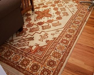 Orange and cream Oriental rug, appr. 9 feet 8 inches by 6 feet