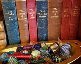 Antique books and Murano glass candy in a Pickard relish dish