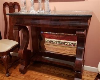 Antique American Empire mahogany marble top server with petticoat mirror