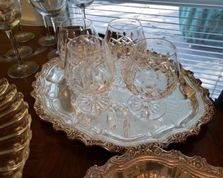 Waterford crystal brandy glasses on a silverplate tray