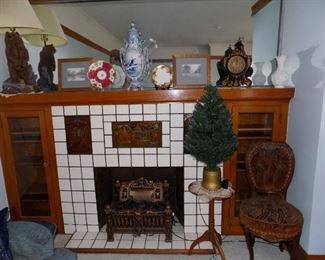 Antique Chair and small table. Pre-lit porch tree. Large Blue and White urn. Artwork. Grilly Bear Lamp