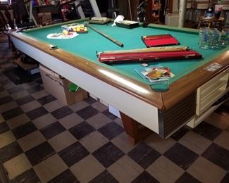 Mid Century Modern Brunswick Billiards table. Pool cues in cases. 