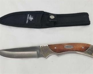 Winchester 3.5" Hunting Knife and Nylon Belt Sheath	
Winchester Stainless Steel 3.5" Blade, Wood and Steel Handle with Decoration on Handle and Signature Blade. New Nylon Belt Sheath