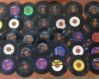 Vinyl 45's circa 1950's	
Approx. 41 items in lot. See photos for examples of artists and titles including Nat King Cole, Elvis Presley, Richie Valens, and more.