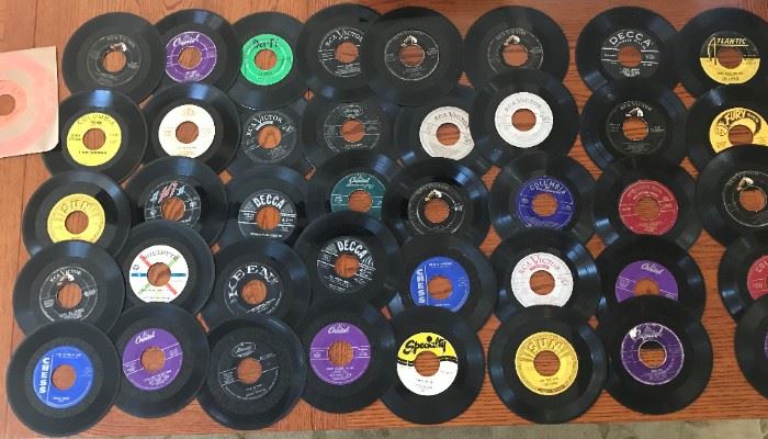 Vinyl 45's circa 1950's	
Approx. 41 items in lot. See photos for examples of artists and titles including Nat King Cole, Elvis Presley, Richie Valens, and more.