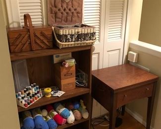 Yarn, sewing items and vintage metal Kenmore sewing machine.