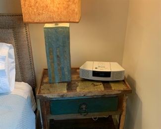 Night stand has a removable wooden tray