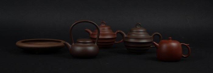 Grouping of Four Yixing Teapots and a Shallow Dish