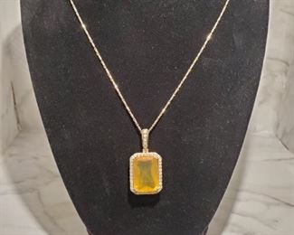14KT YELLOW GOLD FIRE OPAL WITH DIAMONDS NECKLACE. ESTIMATE RETAIL VALUE: $5,140.00. MINIMUM RESERVED BID: $850.00. 