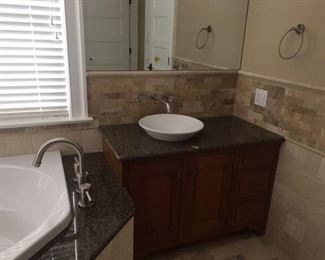 Gorgeous bath vanity with vessel sink on left; mfg. by Quality Custom Cabinetry
