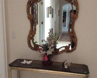 Ornate gold mirror, gold and glass console table
