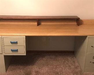 Desk made from counter top and filing cabinets - all pieces are attached 