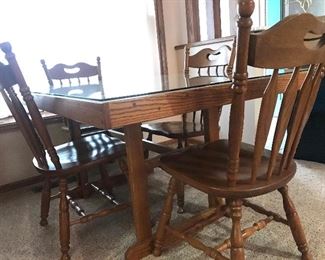 Hand made solid wood parkay table with glass topper and 4 chairs 