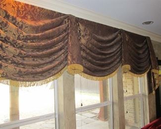 Living room custom drapes in a lush fabric with fringe.